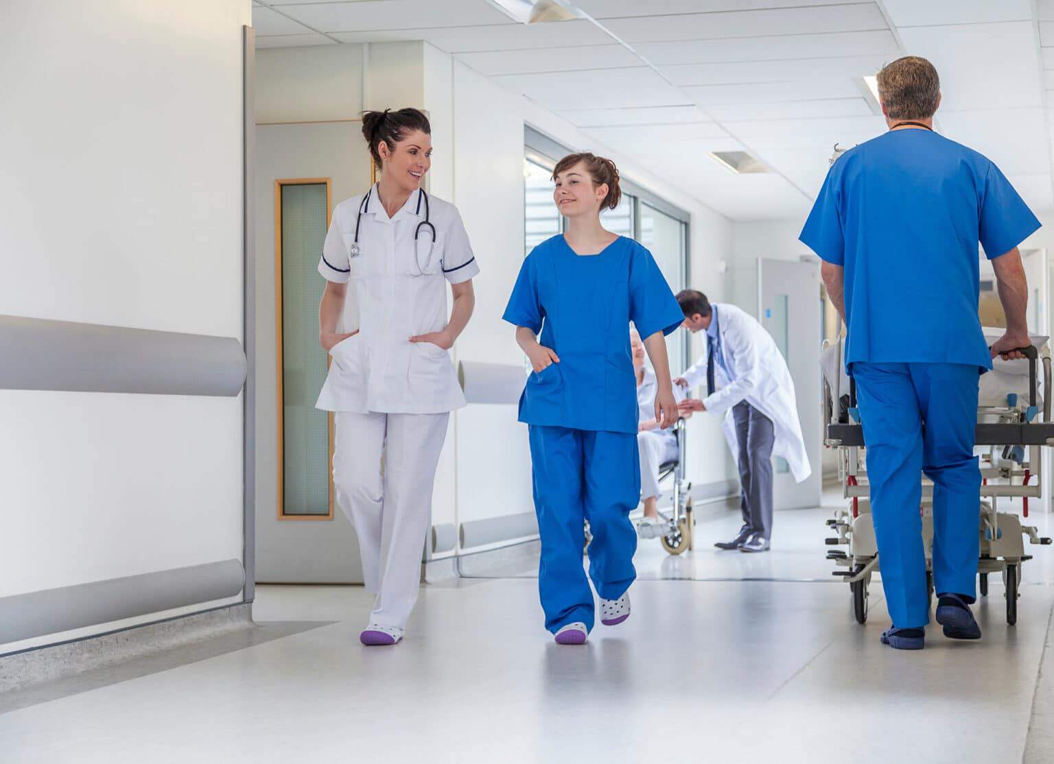 Doctors Hospital Corridor Nurse Pushing Gurney Stretcher Bed
